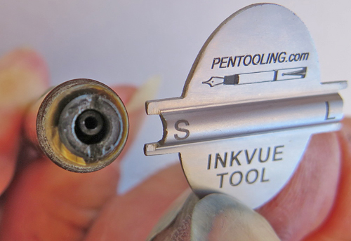 INK VUE TOOL: TOOL FOR REMOVING THREADED PLUG IN THE CENTER OF INK VUE PENS. WORKS ON BOTH SIZES. THIS TOOL HAS TWO SIDES, ONE THAT FITS A LARGE PEN AND ONE SIDE THAT FITS THE SMALLER PEN